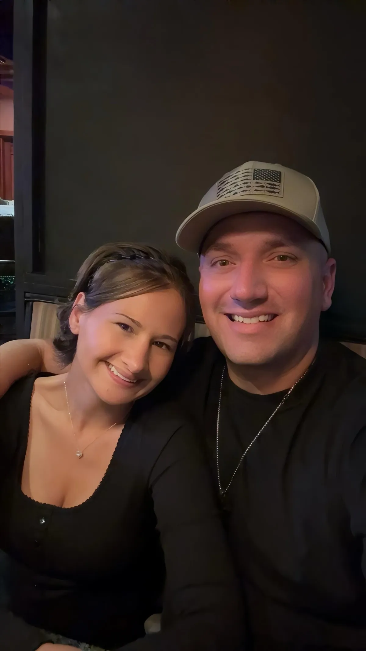 Gypsy Rose Blanchard and Ken Urker smiling together in a selfie at dinner, Ken's arm around her shoulders.