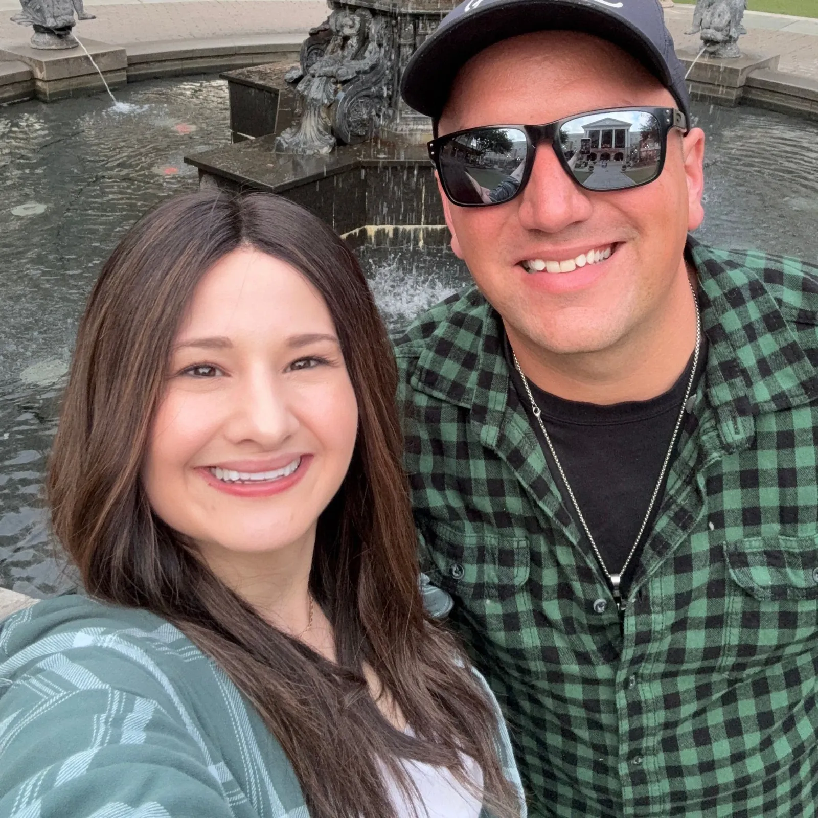 Gypsy Rose Blanchard and Ken Urker smiling in a selfie in front of a fountain.